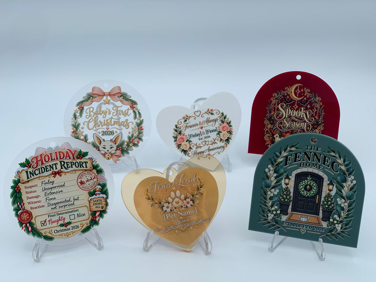Collection of personalized 3.5" acrylic ornaments from Fennec Creations featuring Round, Arch Top, and Heart shapes in multiple finishes with custom UV-printed designs for holidays, milestones, remembrance, photos, and meaningful gifts.