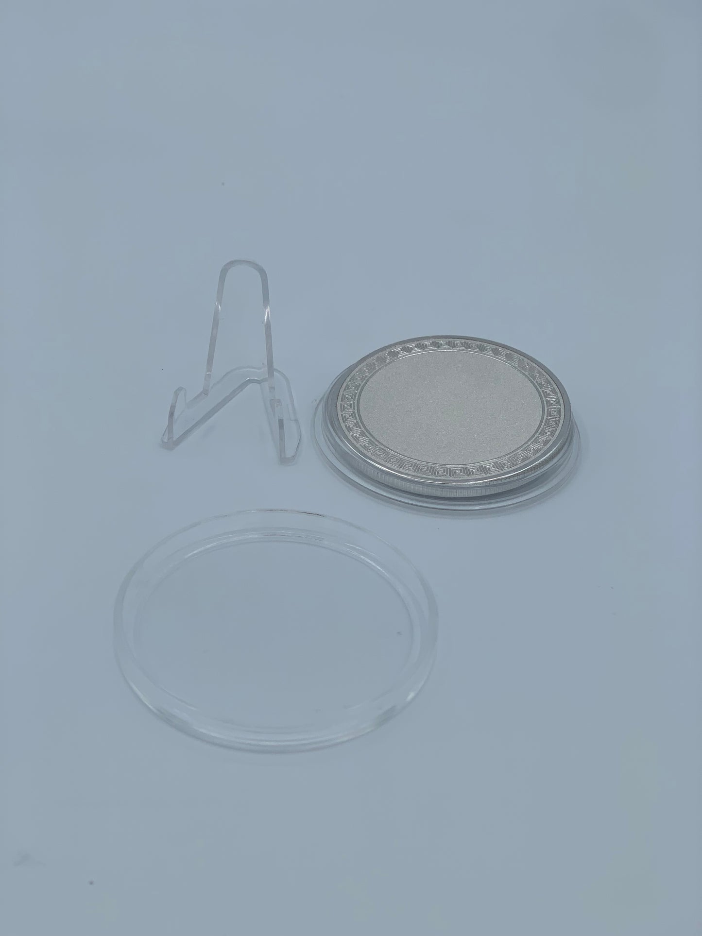 50 mm silver challenge coin with clear protective case and acrylic display stand
