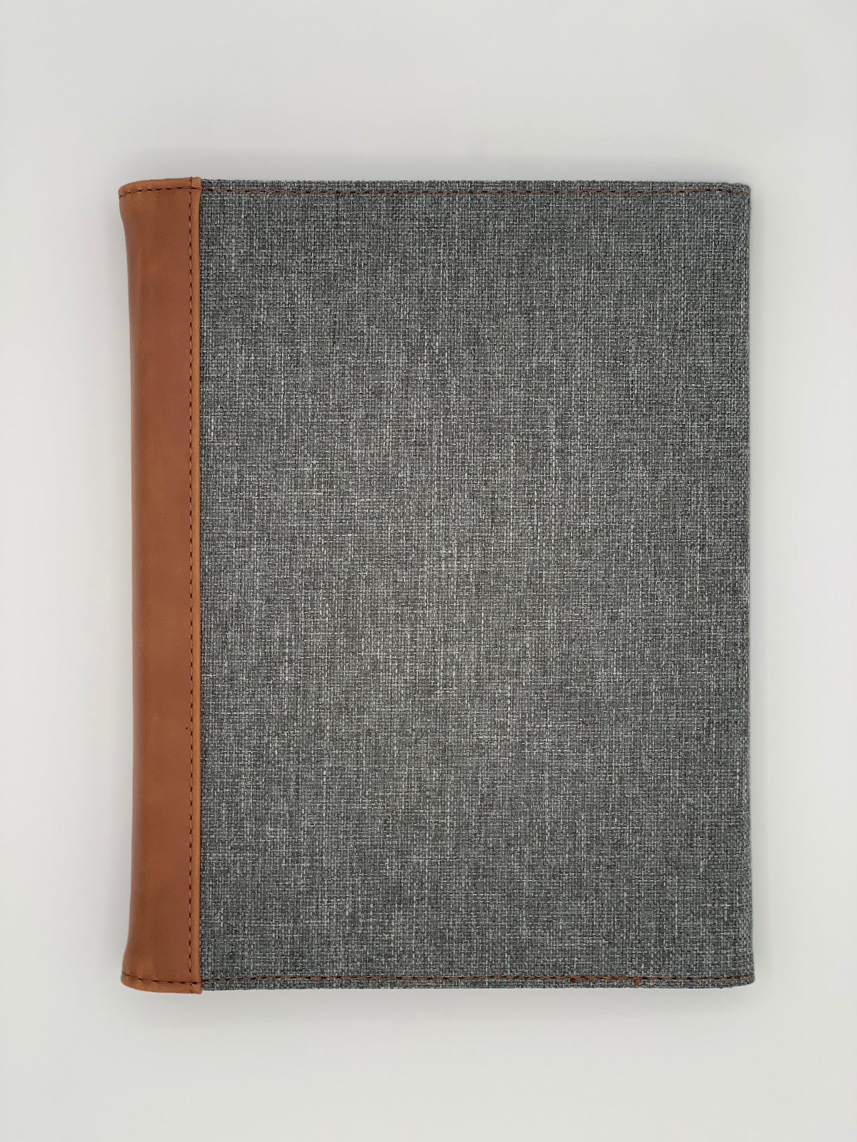 Closed Rawhide/Gray padfolio showing the two-tone back exterior and contrasting leatherette flap.