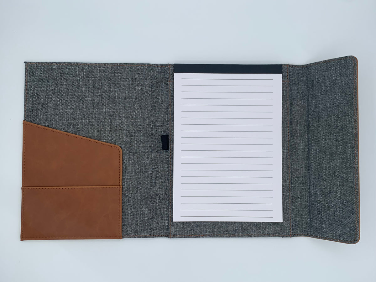 Open Rawhide/Gray padfolio showing the lined writing pad, interior storage pocket, and built-in organization.