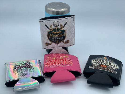 Assorted personalized can koozies featuring custom UV-printed designs in multiple colors, textures, and finishes. Available in both regular and magnetic styles, each is designed to hold a standard 12 oz can and can be customized with names, artwork, logos, or other special designs. Magnetic versions can attach to golf carts, tailgates, refrigerators, and other magnetic surfaces.