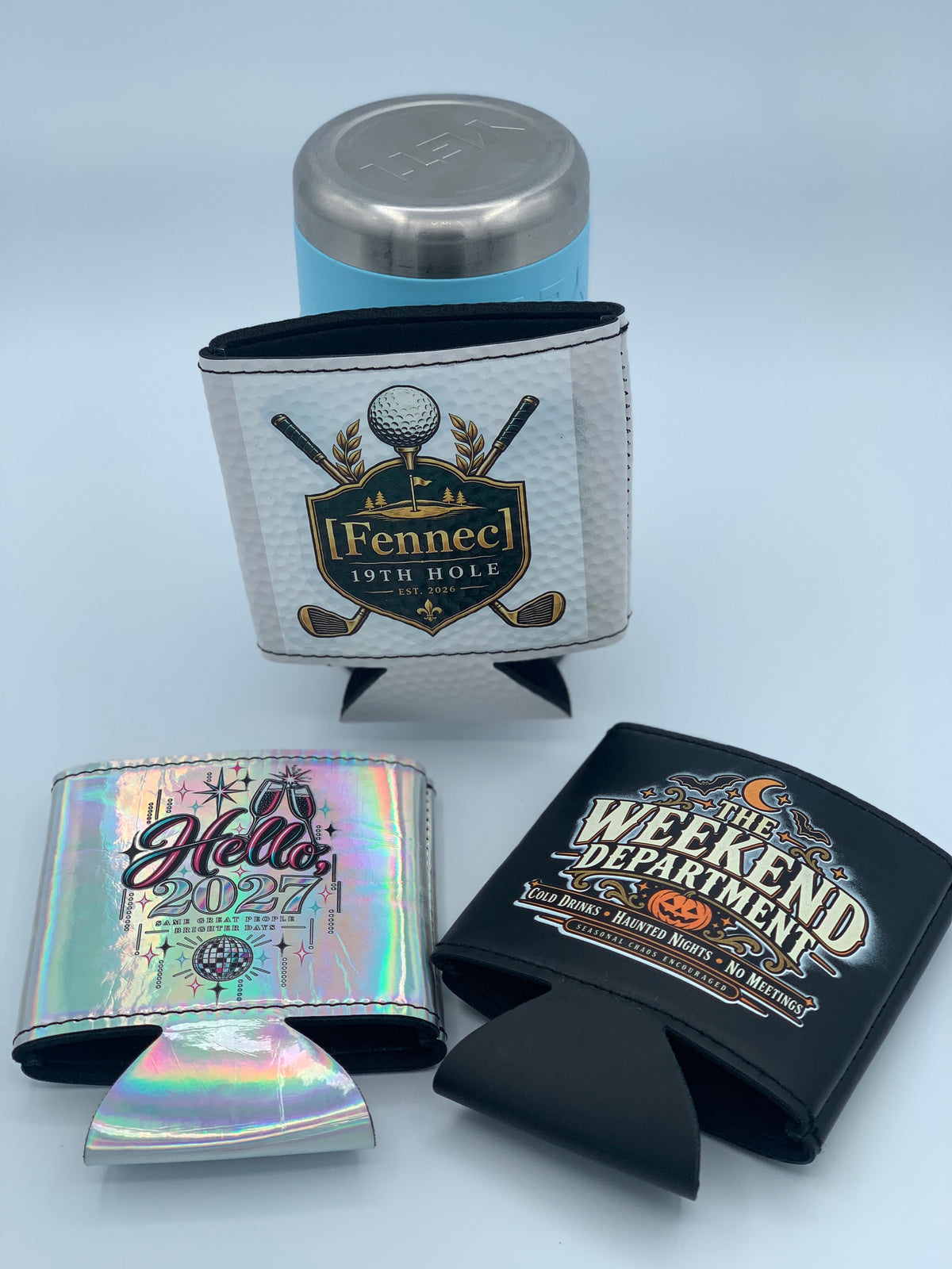 Assorted personalized leatherette can coolers featuring full-color custom designs on White Golf Ball Textured, Holographic, and Black finishes.