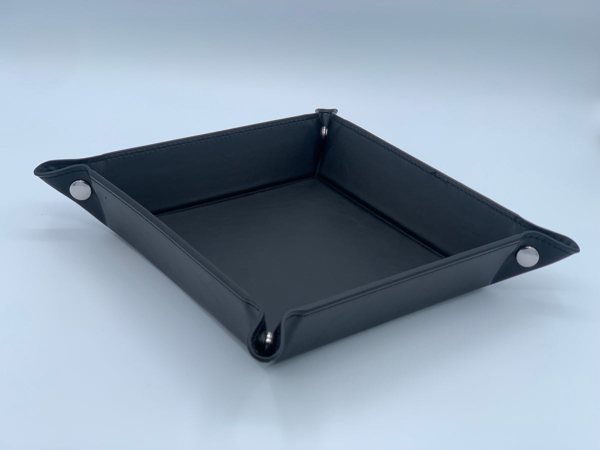 Angled view of the Black leatherette valet tray showing the finished snap-corner shape and interior catchall area.