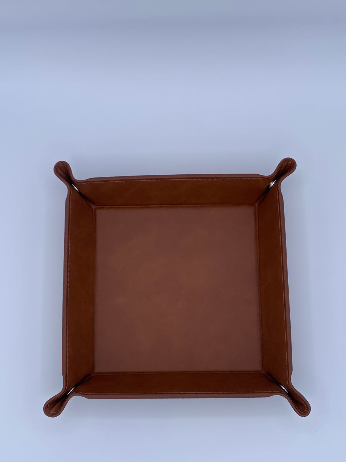 Top view of the Rawhide leatherette valet tray assembled with raised snap-corner sides.