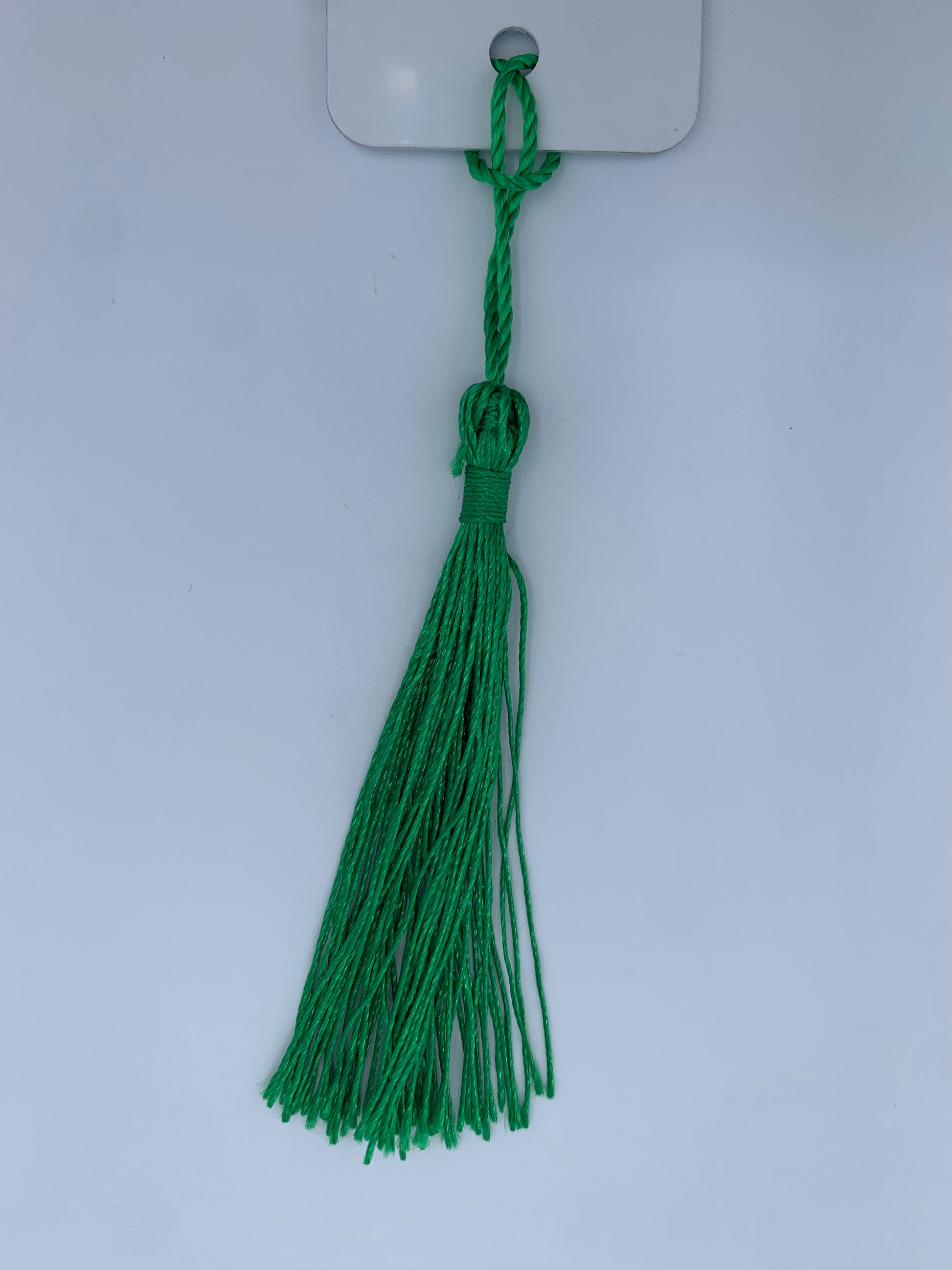 Aluminum bookmark with dark green tassel