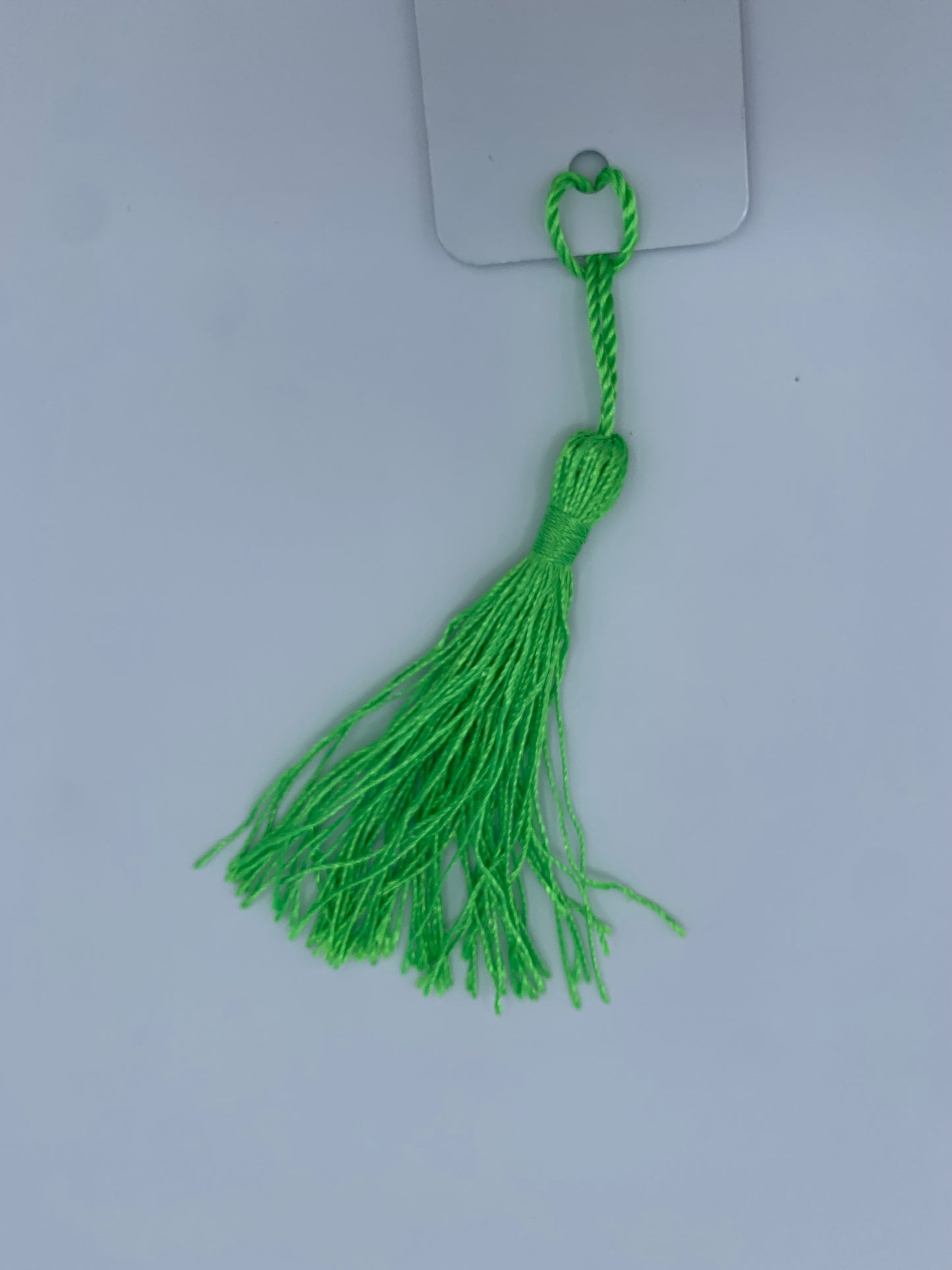 Aluminum bookmark with light green tassel