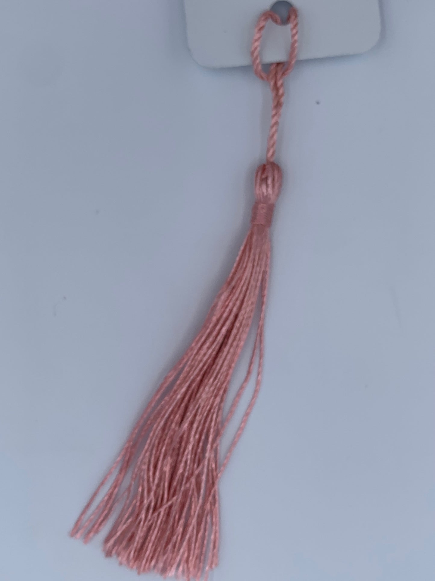 Aluminum bookmark with pink tassel