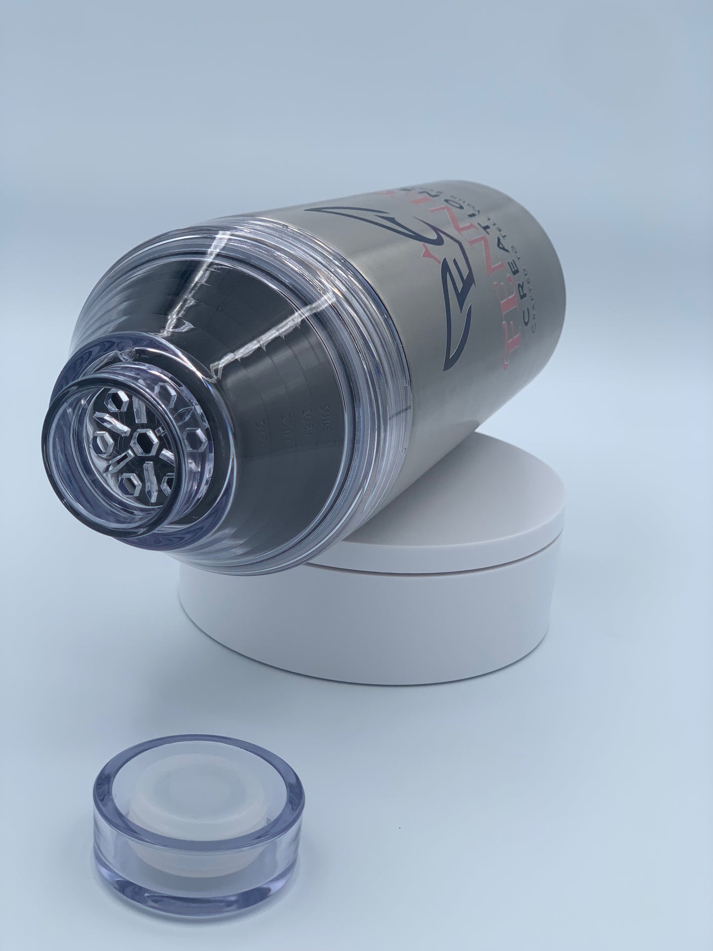 Stainless steel FrostBuddy Big Buddy shown with its cocktail shaker lid and removable components.