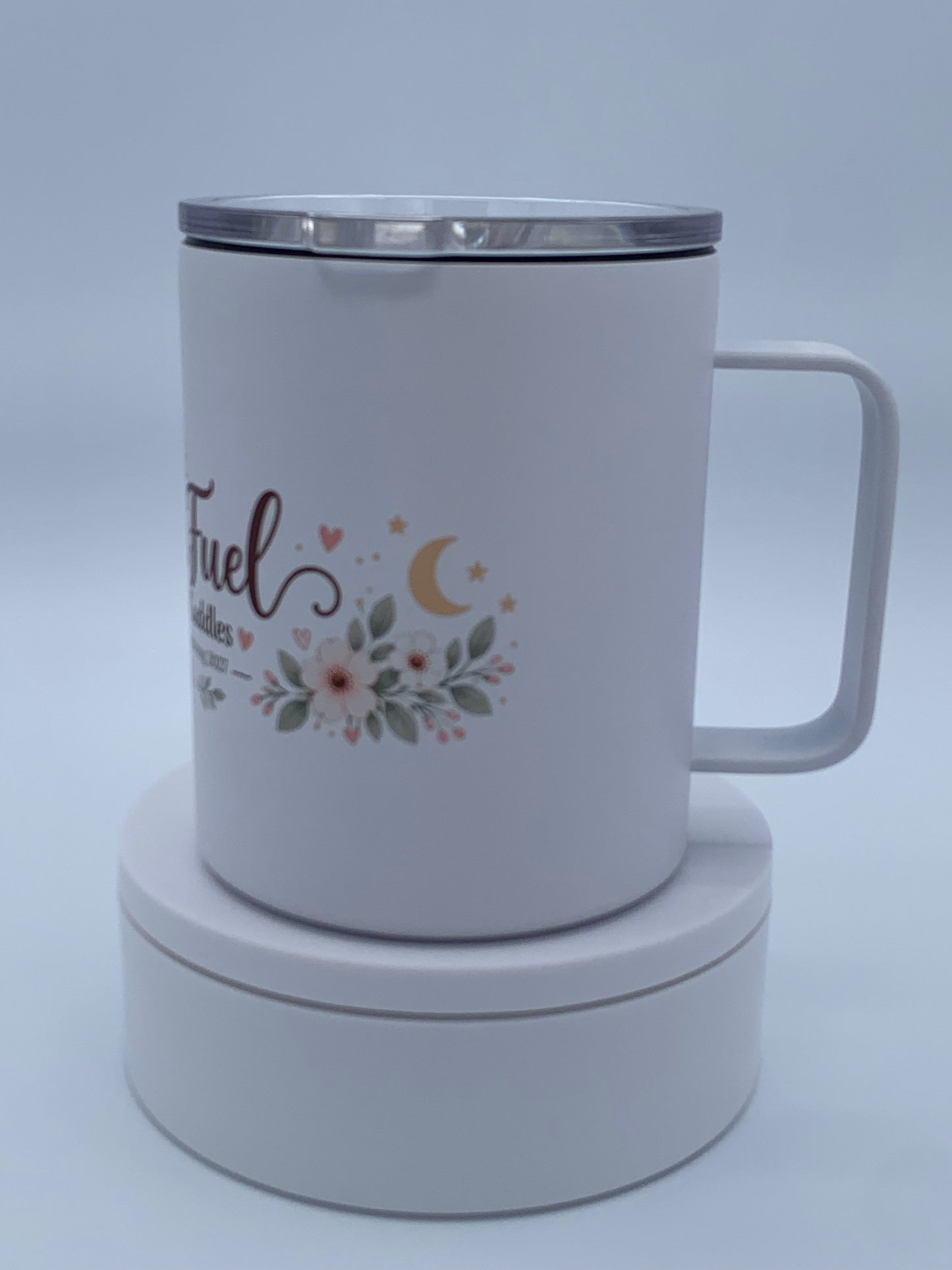 Personalized white 12 oz camper mug showing the handle, profile, and custom printed design.