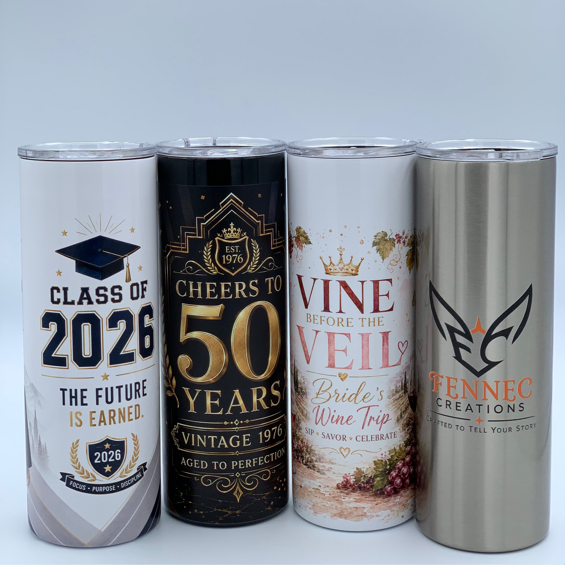 Four personalized 20 oz slim tumblers featuring graduation, 50th birthday, bride's wine trip, and Fennec Creations designs.