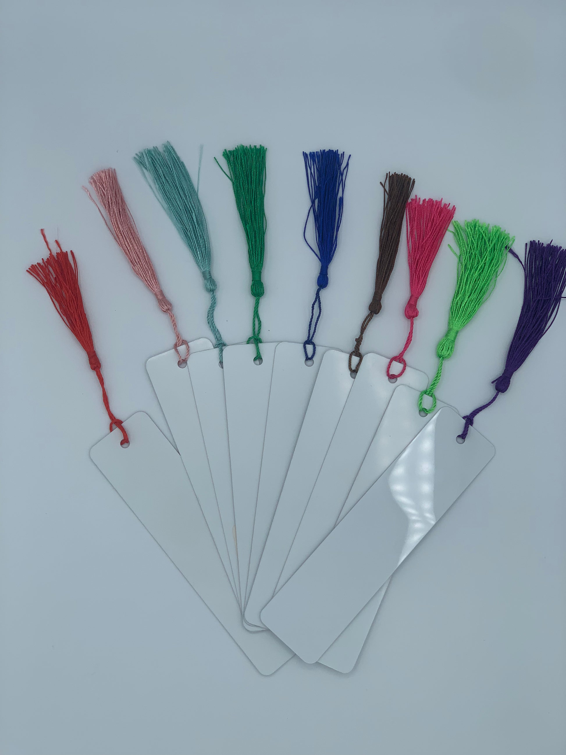 Personalized aluminum bookmark with nine available tassel color options