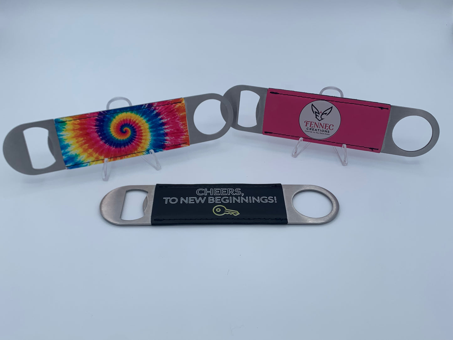 Personalized leatherette bar key bottle openers with custom UV-printed designs.