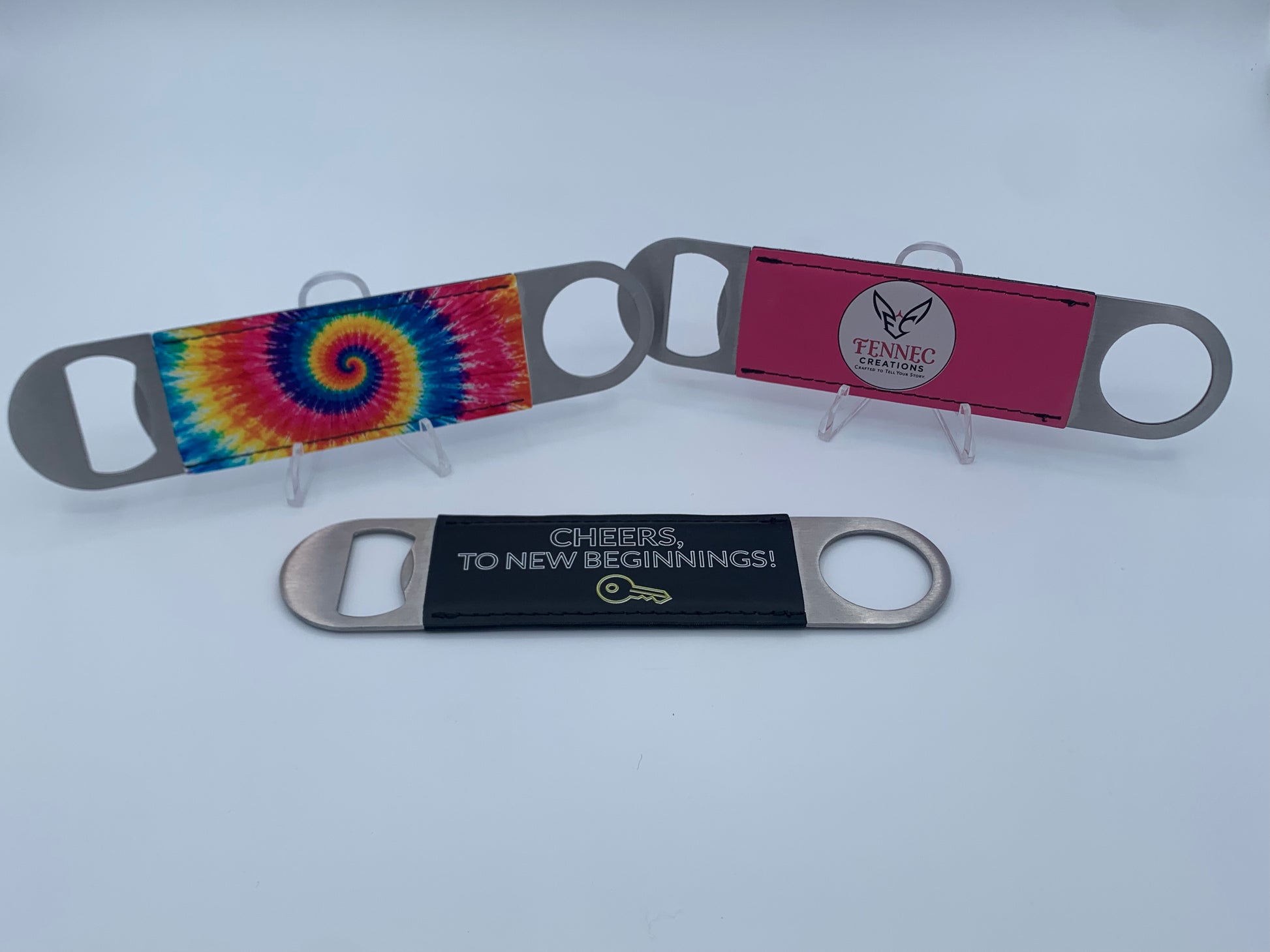 Personalized leatherette bar key bottle openers with custom UV-printed designs.