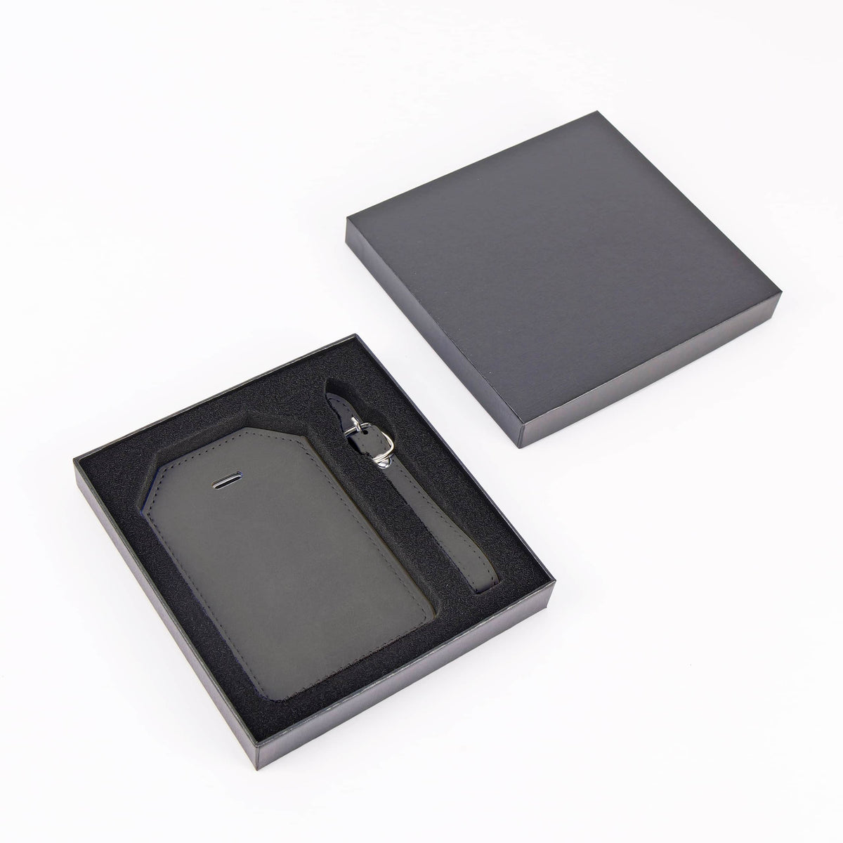 Flint Gray leatherette luggage tag with privacy flap and strap ready for personalization.