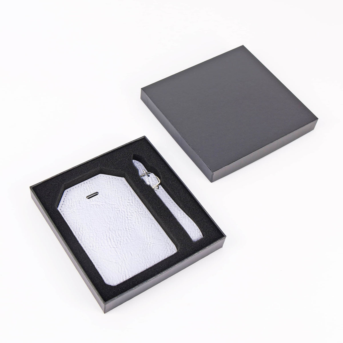 Metallic Silver leatherette luggage tag Signature Finish with privacy flap and strap.
