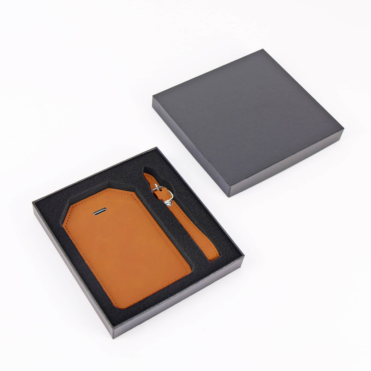 Rawhide leatherette luggage tag with privacy flap and strap ready for personalization.