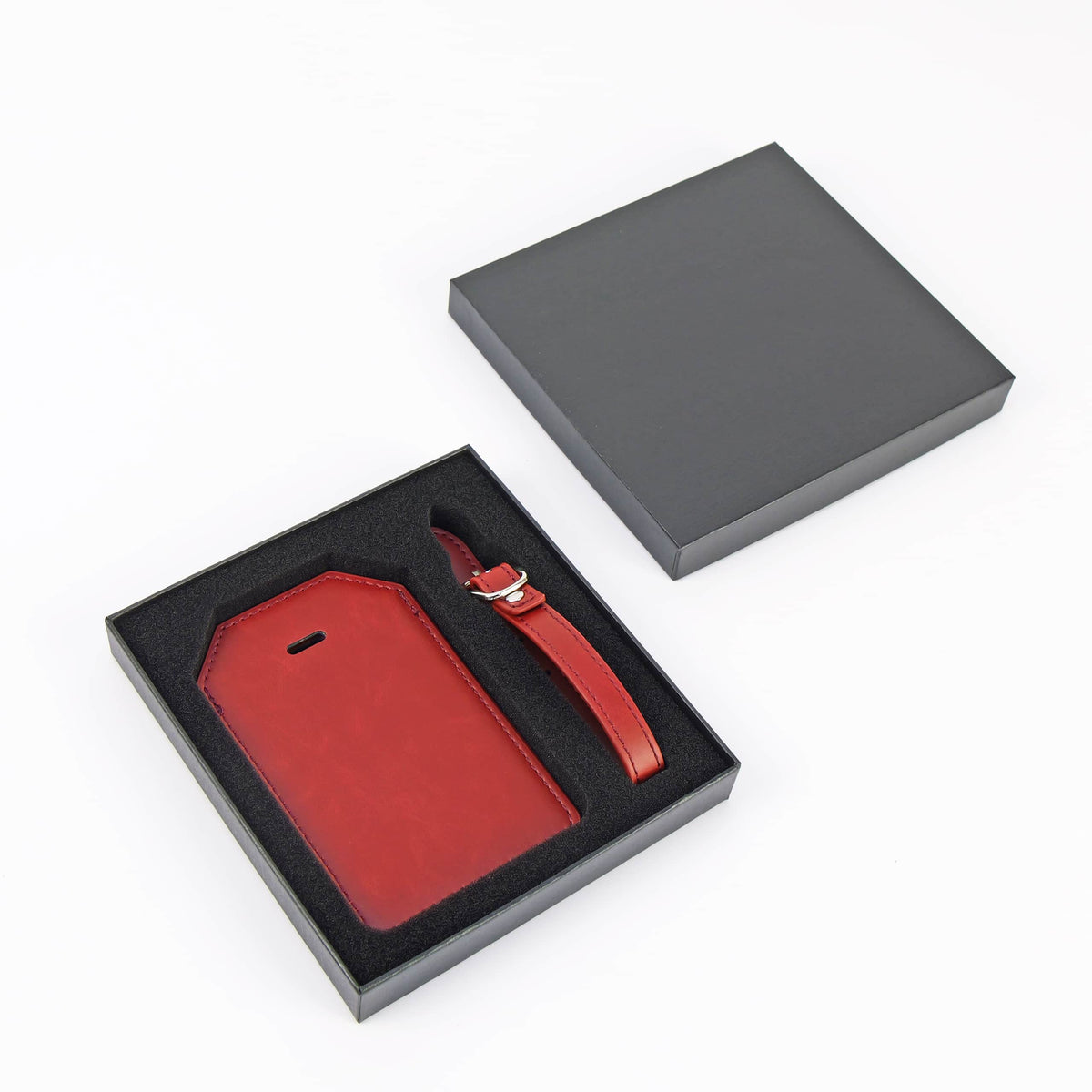 Ruby Red leatherette luggage tag with privacy flap and strap ready for personalization.