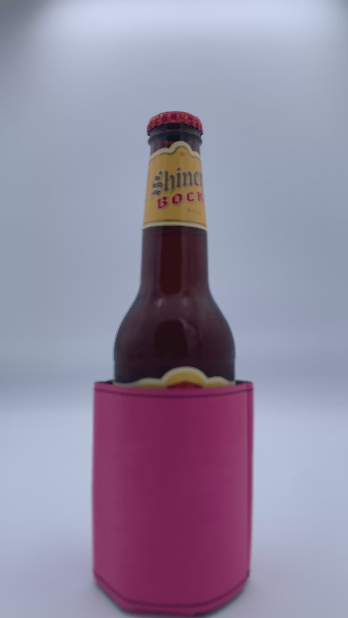 Personalized leatherette bar key bottle opener shown opening a bottled beverage.