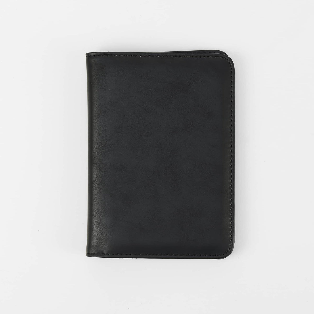 Black leatherette RFID-blocking passport wallet ready for personalization.