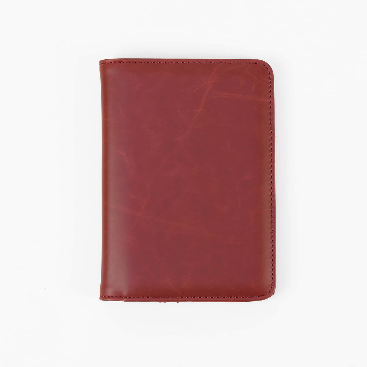 Ruby Red leatherette RFID-blocking passport wallet ready for personalization.
