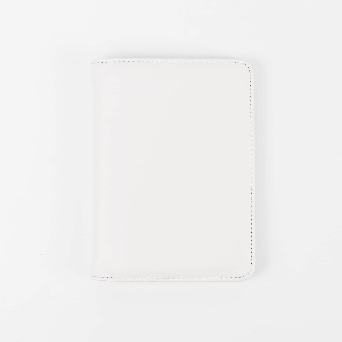 White leatherette RFID-blocking passport wallet ready for personalization.